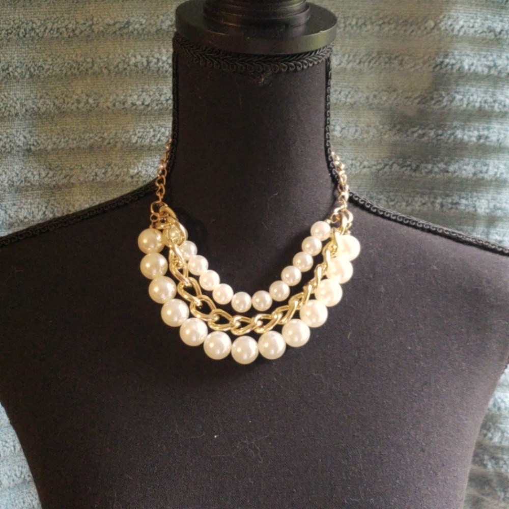 Pearl and gold earrings and necklace